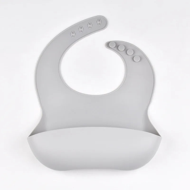 Bavoir en silicone imperméable et souple pour bébé, réglable sur 4 positions, idéal pour les nouveau-nés. Isole les aliments, protège de la saleté et de la salive.
