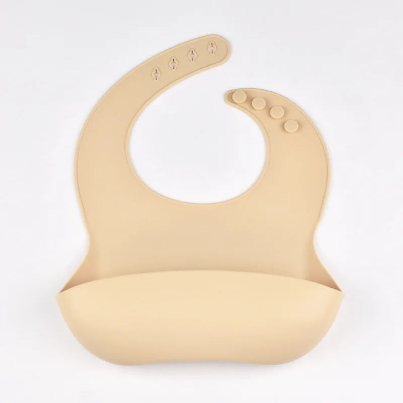 Bavoir en silicone imperméable et souple pour bébé, réglable sur 4 positions, idéal pour les nouveau-nés. Isole les aliments, protège de la saleté et de la salive.